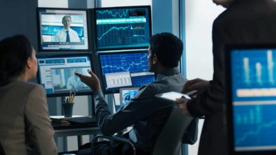 Man online with computers discussing the ASX 200