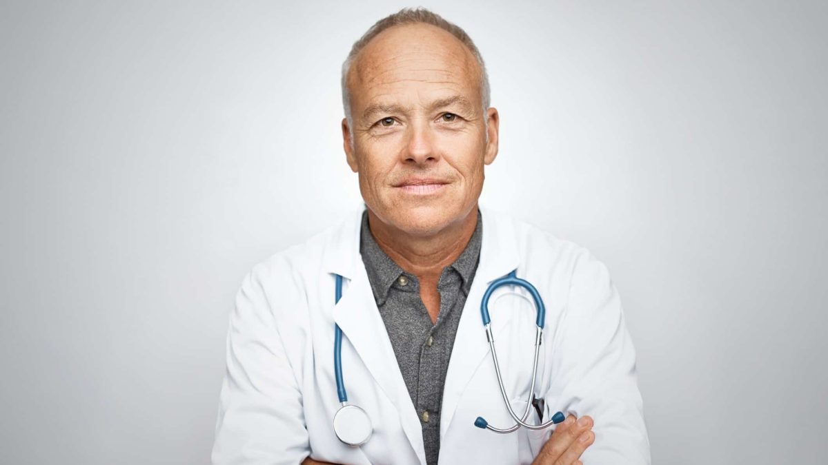 Doctor looking serious with arms crossed