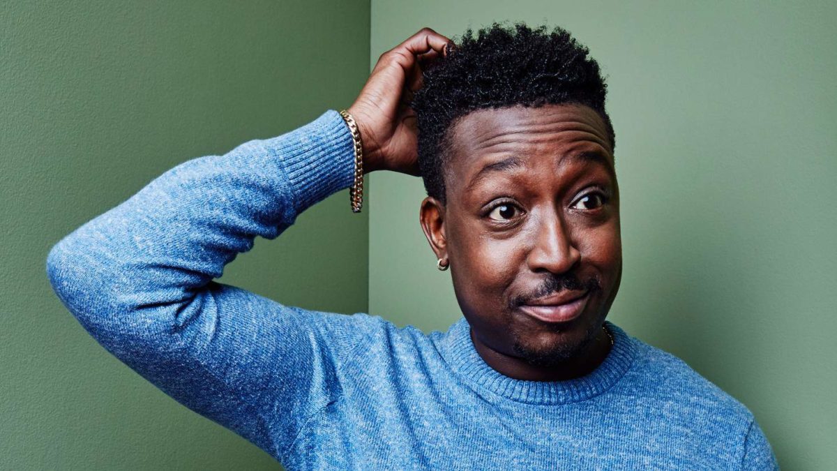 A man scratches his head in confusion.