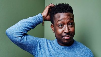 A man scratches his head in confusion.