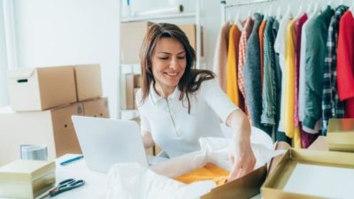 woman looking at her clothing package