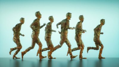 a group of six sculptures of human figures running in the same direction.