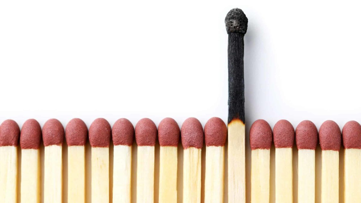 a dead match stands out from a row of matches yet to be struck.