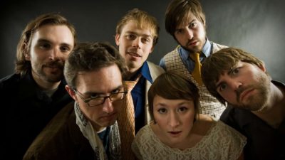 A group of people look intently towards the camera as though they are very interested in the information they are hearing.