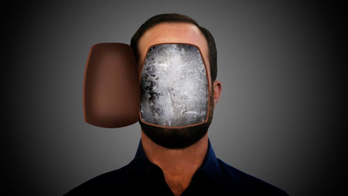 The front of a man's face opens to reveal he has frozen ice for brains.