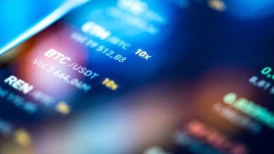 Smartphone with a list of alt coins.