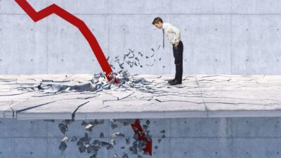 An arrow crashes through the ground as a businessman watches on.