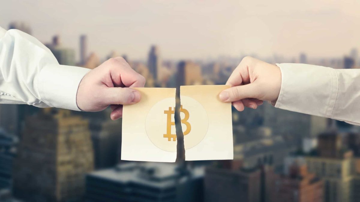 A ripped piece of paper with the Bitcoin logo.