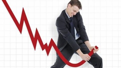 Man shaking off share price movement.