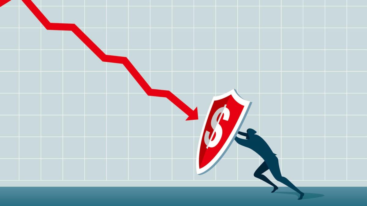 Concept image of man holding up a falling arrow with a shield.