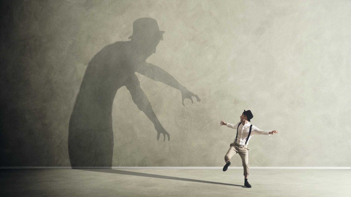 A man jumps at his own shadow, haunted by past decisions.