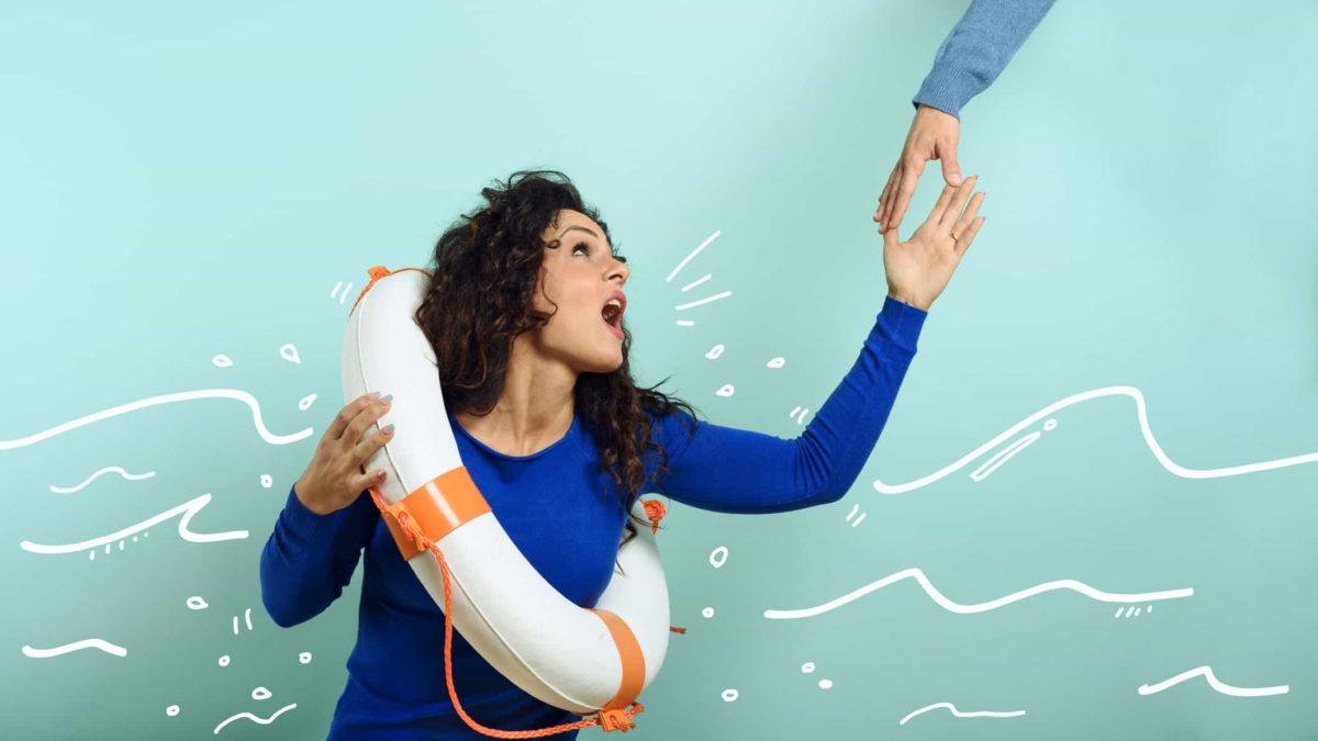 A woman wearing a lifebuoy ring reaches up for help as an arm comes down to rescue her.