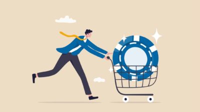 Blue chip in a trolley with a man pushing it.