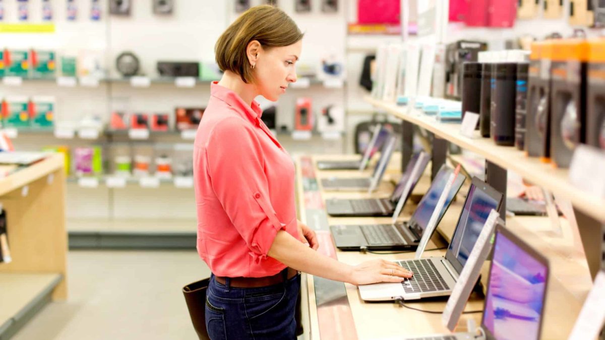 Woman checking out new laptops.