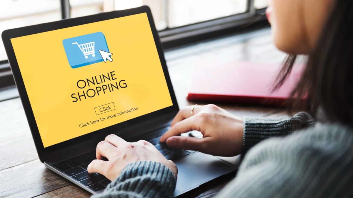 Woman Online shopping on a laptop.
