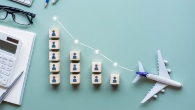 Falling plane share price represented by a declining line with a model plane at the end.