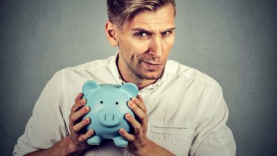 A man thinks very carefully about his money and investments.