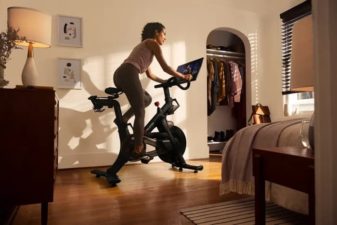 Woman exercising on Peloton bike